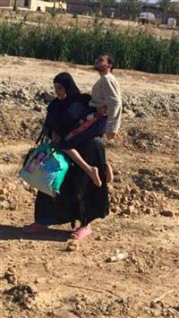 عکسی تکان‌دهنده از رنج یک زن آواره عراقی!