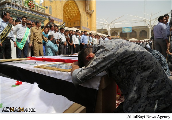 عکس/ تشییع پیکر ده ها شهید عراقی در حرم امام علی(ع)