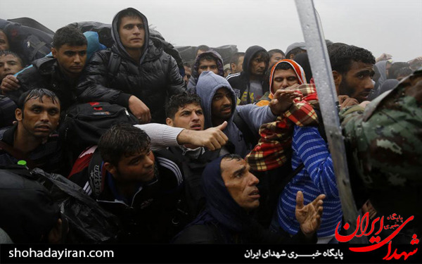 عکس/مهاجران زیر باران