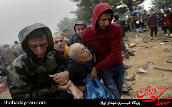 عکس/مهاجران زیر باران