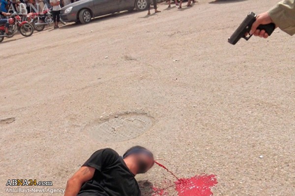 اعدام علنی جوان عراقی به دست داعش + عکس