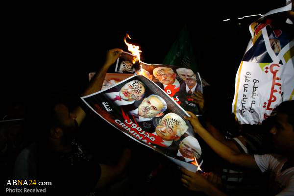 آتش زدن تصاویر محمود عباس و نتانیاهو + عکس