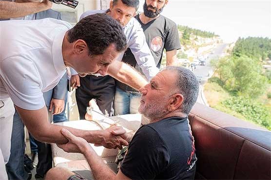 دیدار بشار اسد و همسرش با مجروحان و فرزندان شهدا