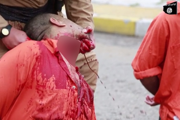 داعش با ذبح یک پیشمرگه بارزانی را تهدید کرد+عکس