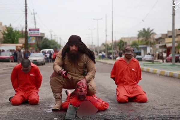 داعش با ذبح یک پیشمرگه بارزانی را تهدید کرد+عکس